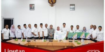 Plt. Bupati Labuhanbatu Berikan 1.500 Kartu Peserta BPJS Ketenagakerjaan